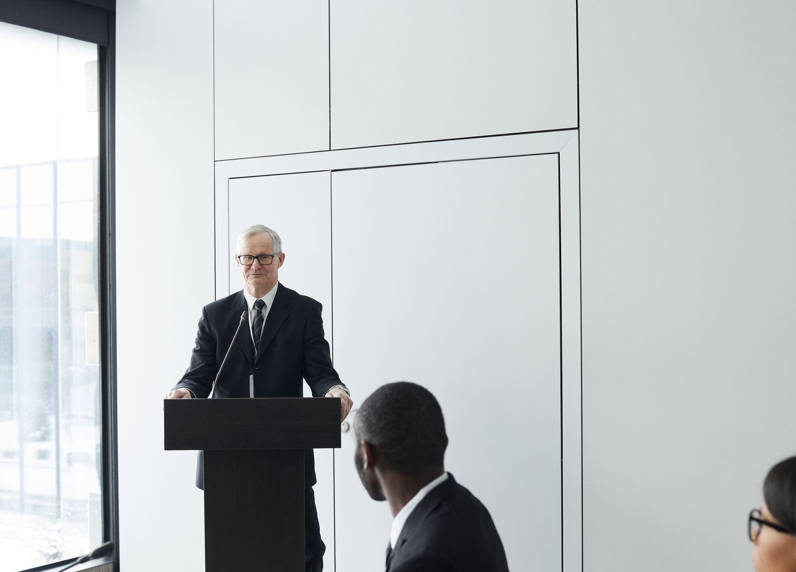 A finance team listening to a presentation in a boardroom