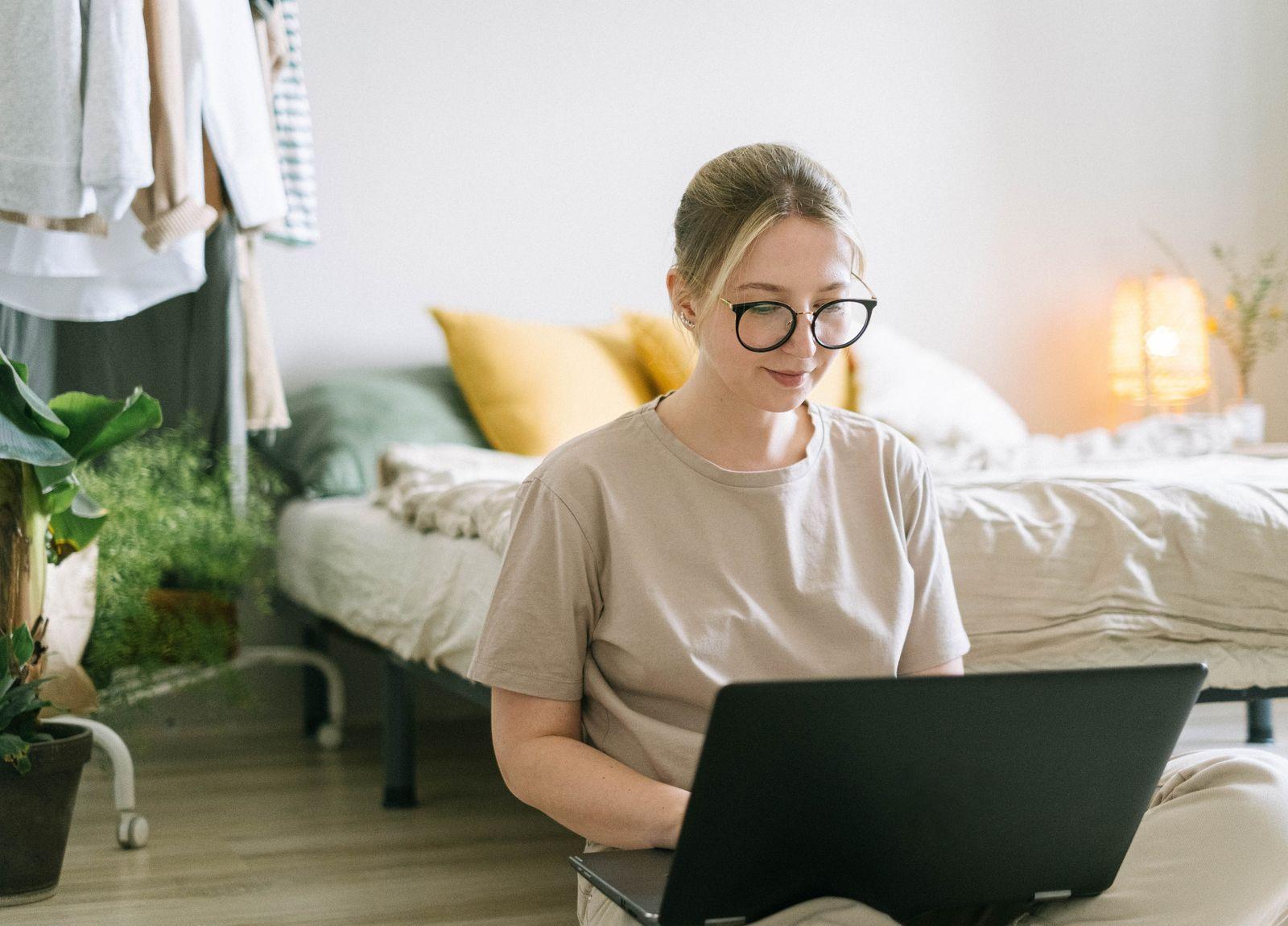 A freelancer working on a laptop at home